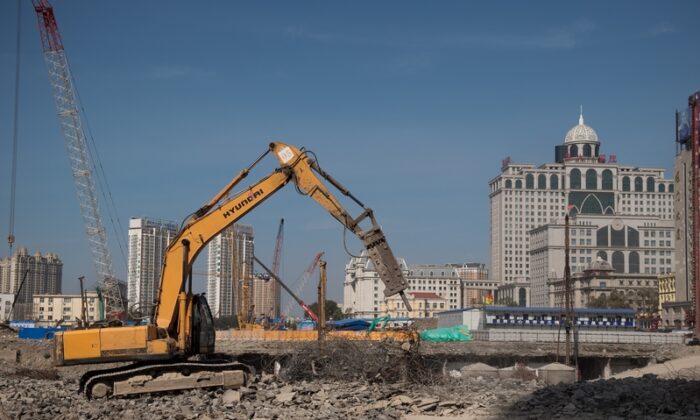 Since the third quarter of 2021, China's land market has cooled, demand has fallen, and local land sales revenue has plummeted. Some provinces and cities in China have reportedly cut  civil servants' salaries. (Nicolas Asfouri/AFP/Getty Images)