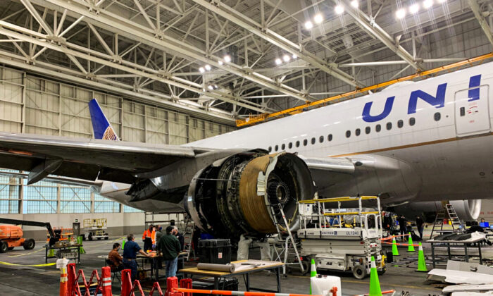 The damaged starboard engine of United Airlines flight 328, a Boeing 777-200, is seen following a Feb. 20 engine failure incident, in a hangar at Denver International Airport in Denver, on Feb. 22, 2021. (National Transportation Safety Board/Handout via Reuters)