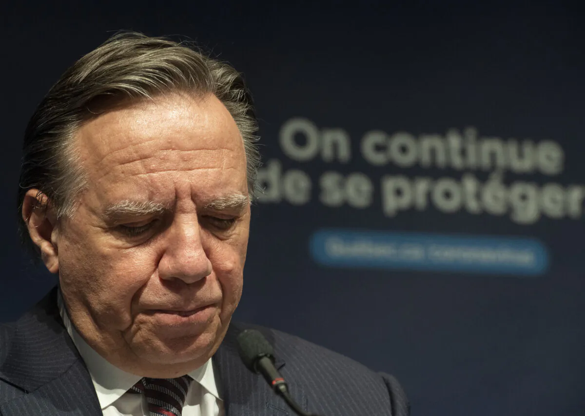 Quebec Premier Francois Legault speaks during a news conference in Montreal, on Dec. 22, 2021, where he gave an update on the ongoing COVID-19 pandemic. (The Canadian Press/Graham Hughes)