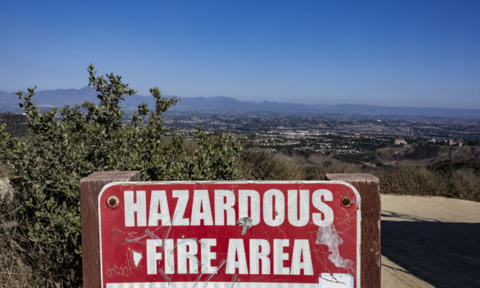 A warning sign for fires  overlooks south Orange County in Laguna Beach, Calif., on Dec. 15, 2020. (John Fredricks/The Epoch Times)