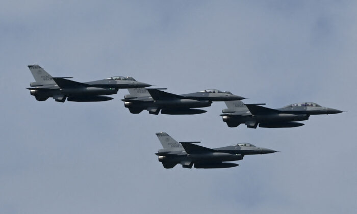 Four upgraded U.S.-made F-16 V fighters fly during a demonstration at a ceremony at the Chiayi Air Force in southern Taiwan on Nov 18. 2021. (Sam Yeh/AFP via Getty Images)