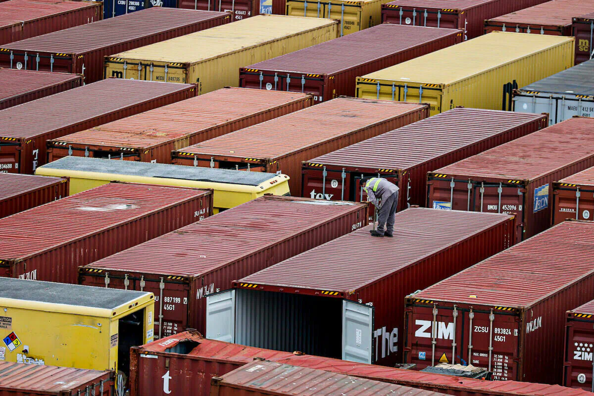 Shipping containers are stacked after being offloaded from a boat in Miami, Fla., on Nov. 4, 2021. (Joe Raedle/Getty Images)