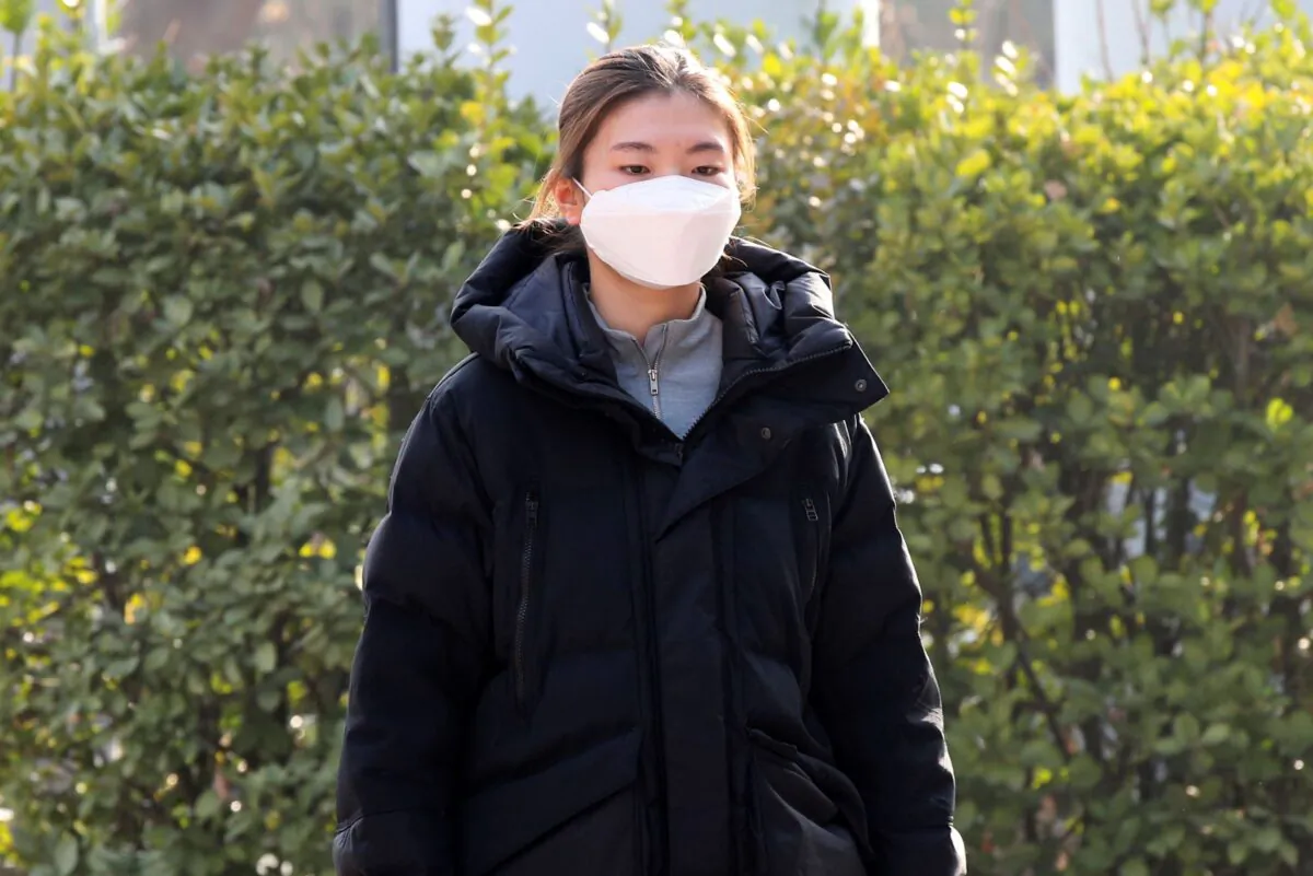 South Korean two-time Olympic short-track champion Shim Suk-hee arrives to attend a disciplinary hearing by the Korea Skating Union (KSU) at the KSU's headquarters in Seoul, South Korea, on Dec. 21, 2021. (Koh June-beom/Newsis via AP)