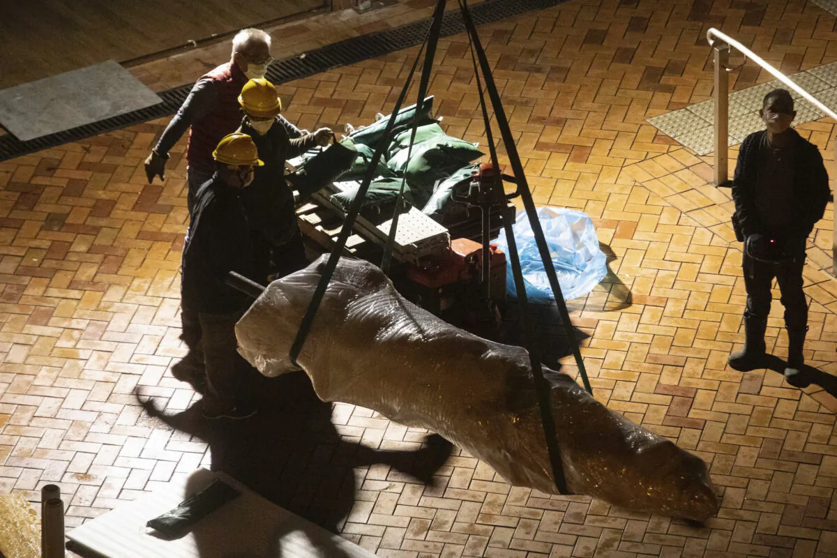 The "Pillar of Shame" statue, a memorial for those killed in the 1989 Tiananmen massacre, is removed from the University of Hong Kong, on Dec. 23, 2021. (Lam Chun Tung/The Initium Media via AP) 
