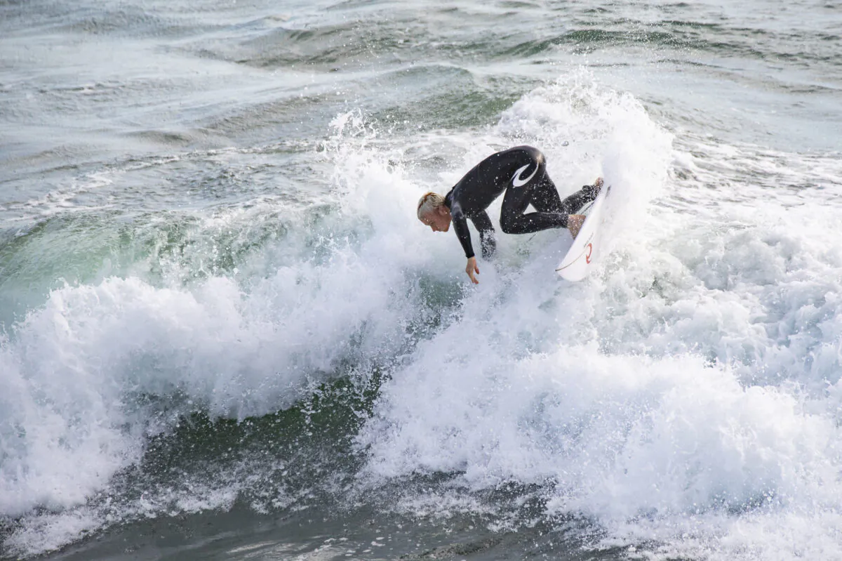 Surfers enjoy the waves of Huntington Beach, Calif., on Sept. 22, 2021. (John Fredricks/The Epoch Times)