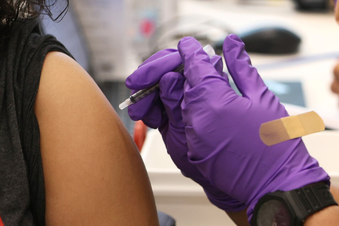 A person receives a COVID-19 vaccine at the Jackson Memorial Hospital in Miami, Fla., on April 15, 2021. (Joe Raedle/Getty Images)