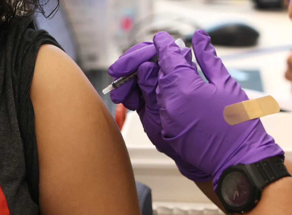 A person receives a COVID-19 vaccine at the Jackson Memorial Hospital in Miami, Florida, on April 15, 2021. (Joe Raedle/Getty Images)