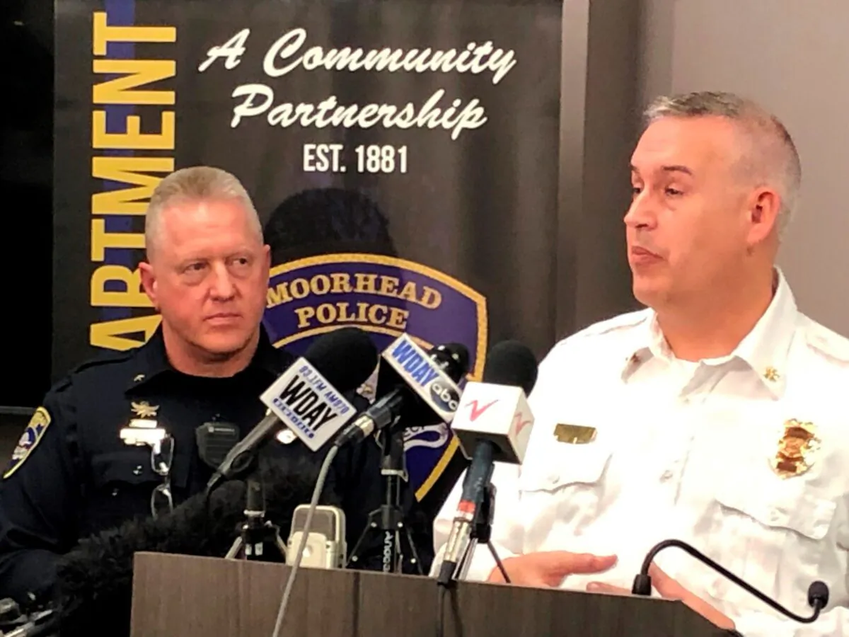 Moorhead, Minn., Police Chief Shannon Monroe (L), and acting Fire Chief Jeff Wallin appear at a news conference to talk about the deaths of seven residents who died from carbon monoxide poisoning, on Dec. 22, 2021. (Dave Kolpack/AP Photo)