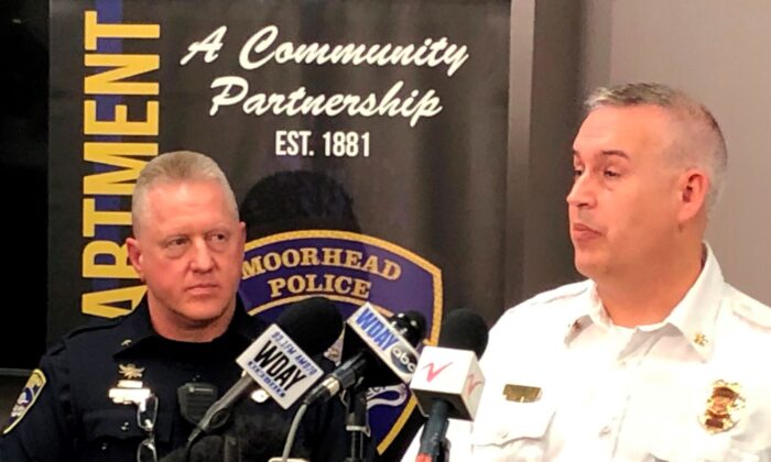 Moorhead, Minn., Police Chief Shannon Monroe (L), and acting Fire Chief Jeff Wallin appear at a news conference to talk about the deaths of seven residents who died from carbon monoxide poisoning, on Dec. 22, 2021. (Dave Kolpack/AP Photo)