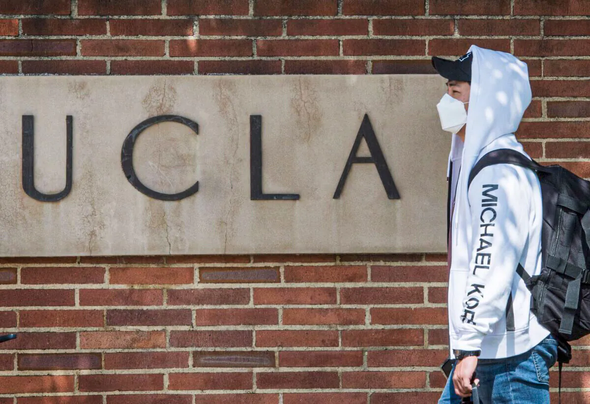 A student wears a face mask on the campus of the UCLA college in Westwood, Calif., on March 6, 2020. (Mark Ralston/AFP via Getty Images)