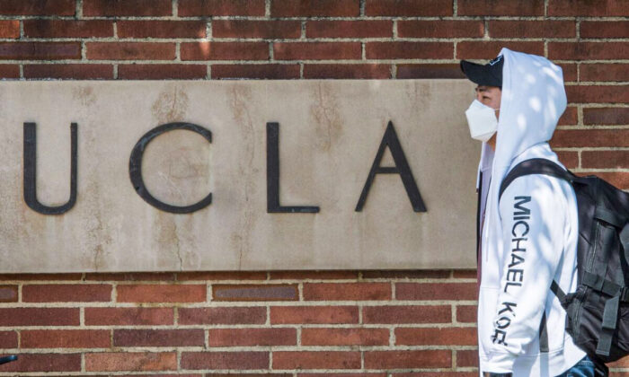 A student wears a face mask on the campus of the UCLA college in Westwood, California on March 6, 2020. (Mark Ralston/AFP via Getty Images)