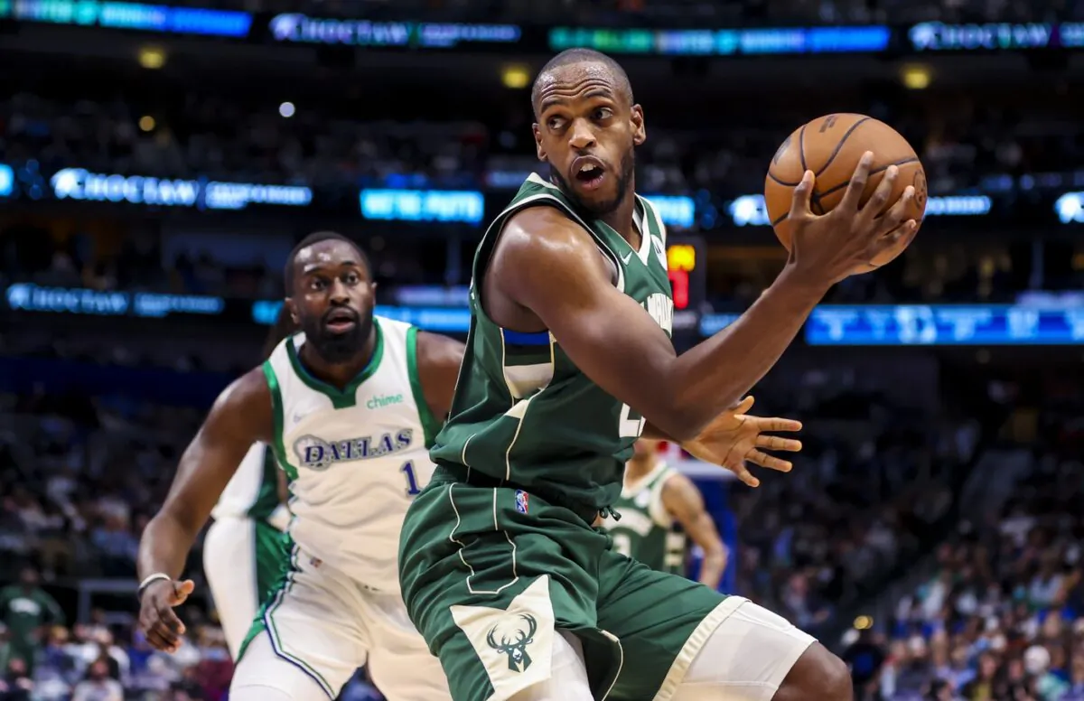 Milwaukee Bucks forward Khris Middleton (22) controls the ball as Dallas Mavericks small forward Theo Pinson (1) defends during the first half at American Airlines Center in Dallas, on Dec. 23, 2021. (Kevin Jairaj/USA TODAY Sports via Field Level Media)