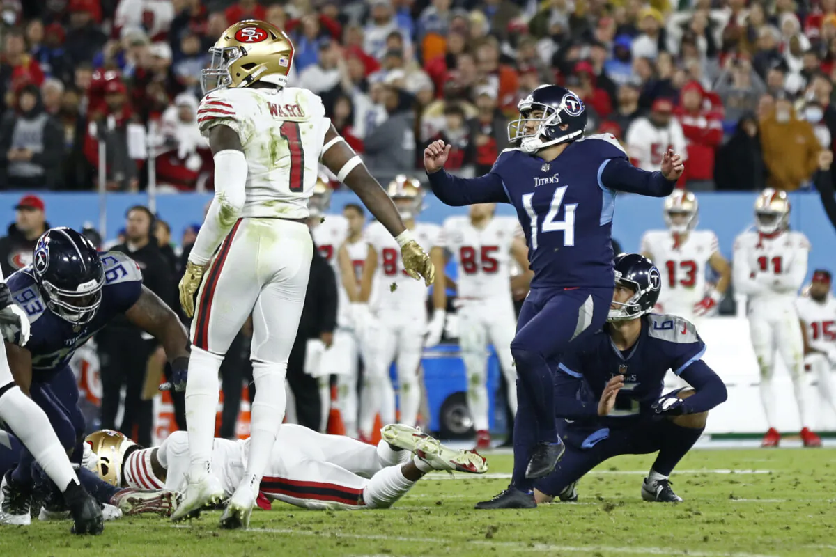 Tennessee Titans kicker Randy Bullock (14) watches his 44-yard field goal in the final seconds of the fourth quarter of an NFL football game against the San Francisco 49ers Thursday, Dec. 23, 2021, in Nashville, Tenn. The field goal gave the Titans a 20-17 win. (AP Photo/Wade Payne)