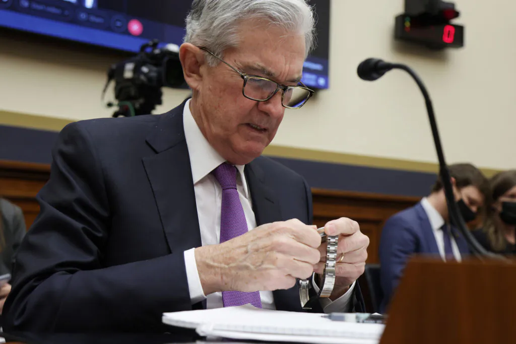 Federal Reserve Board Chairman Jerome Powell checks his watch during a hearing before the House Financial Services Committee on Capitol Hill in Washington, on Dec. 1, 2021.(Alex Wong/Getty Images)