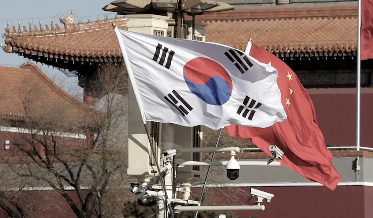 South Korea and China's flags flutter next to Tiananmen Gate in Beijing, China, on Dec. 15, 2017. (Jason Lee/Reuters)
