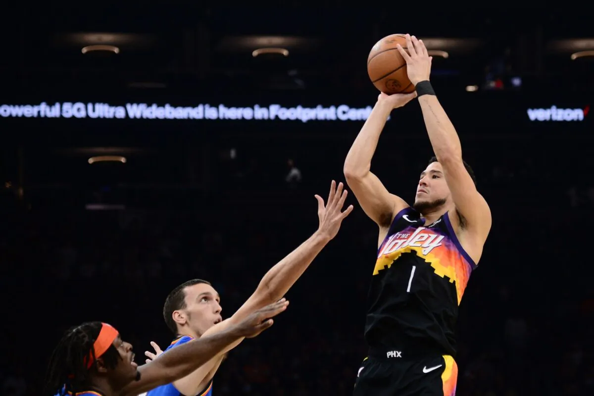 Phoenix Suns guard Devin Booker (1) shoots the ball against the Oklahoma City Thunder during the first half at Footprint Center in Phoenix, on Dec. 23, 2021. (Joe Camporeale/USA TODAY Sports via Field Level Media)