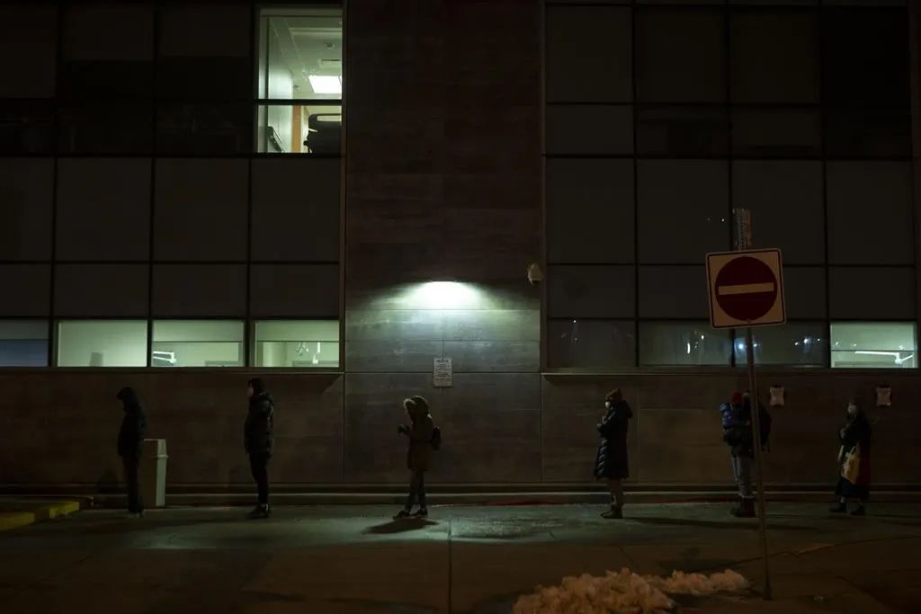 People wait in line for COVID-19 testing at a Hospital in Toronto on Dec. 22, 2021. (The Canadian Press/Chris Young)