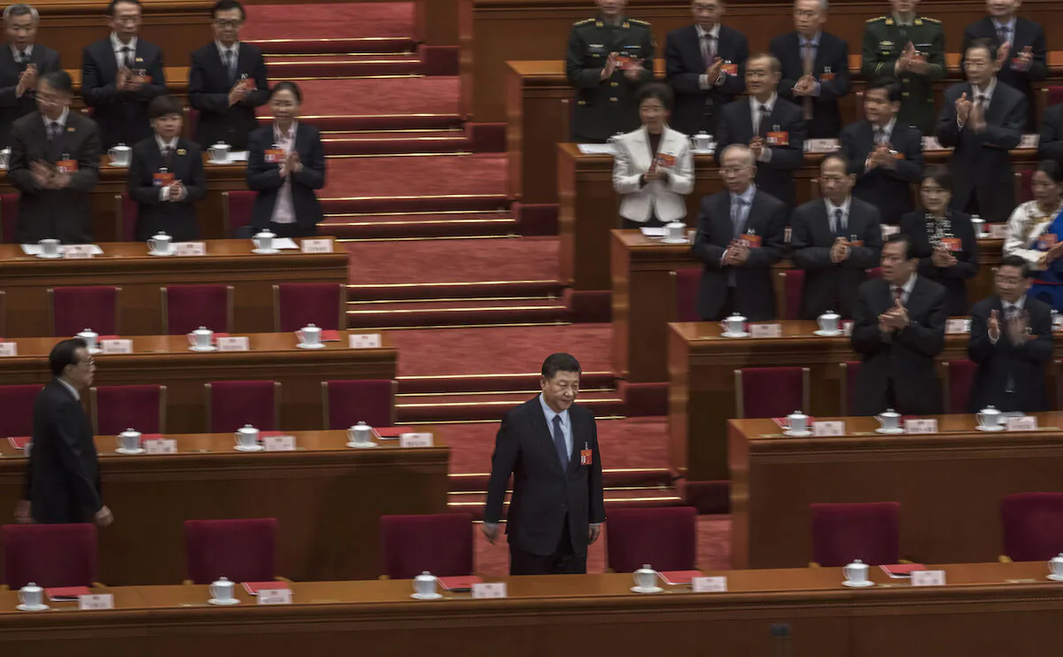Chinese Communist Party’s head Xi Jinping, bottom center, arrives for the closing meeting of the National People's Congress (NPC) on March 15, 2019 in Beijing, China. (Kevin Frayer/Getty Images)