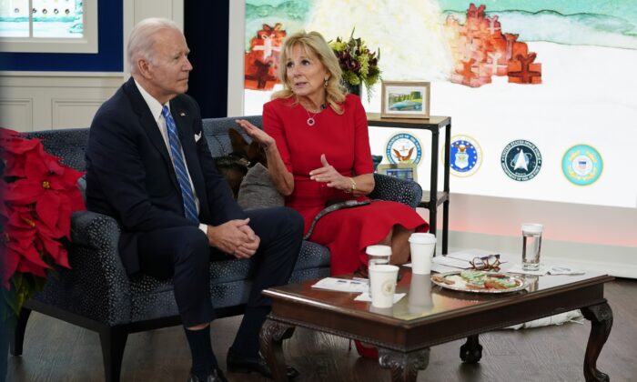 President Joe Biden and first lady Jill Biden meet virtually with service members around the world to thank them for their service and wish them a Merry Christmas, in the South Court Auditorium on the White House campus, on Dec. 25, 2021. (Carolyn Kaster/AP Photo)
