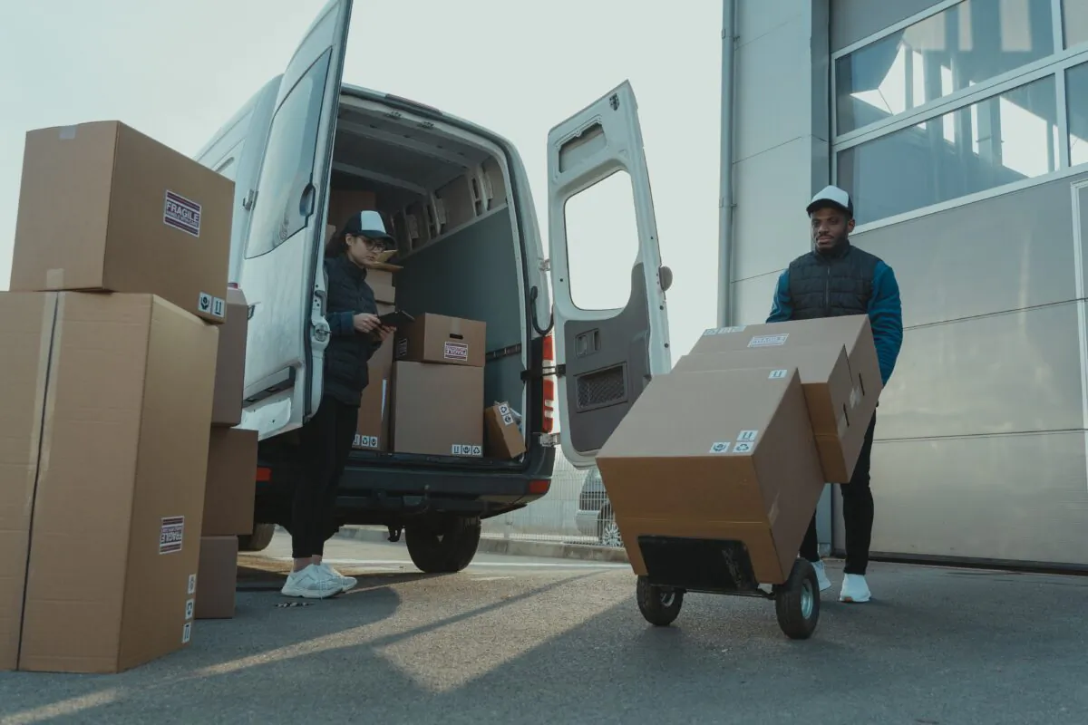 Stock photo of workers working for a delivery company. (Tima Miroshnichenko/Pexels)