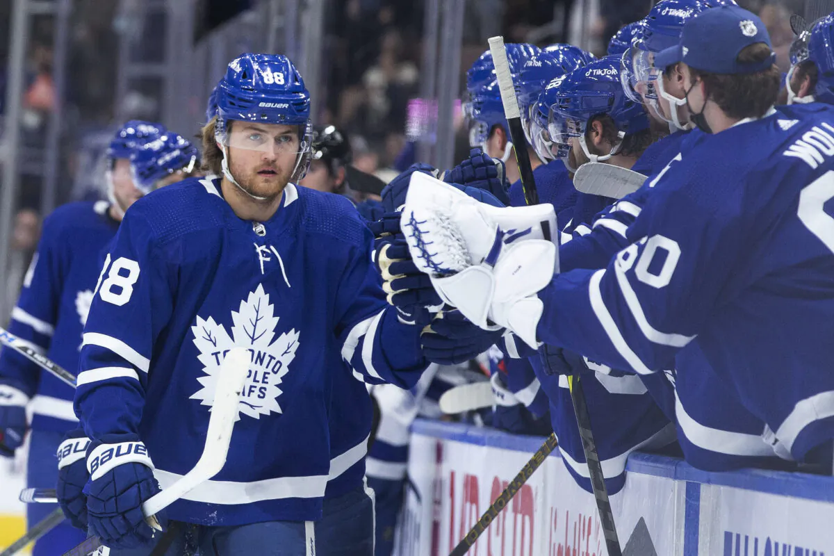 Toronto Maple Leafs' William Nylander is congratulated for his goal against the Tampa Bay Lightning, during an NHL game in Toronto, on Dec. 9, 2021. (Chris Young/The Canadian Press via AP)