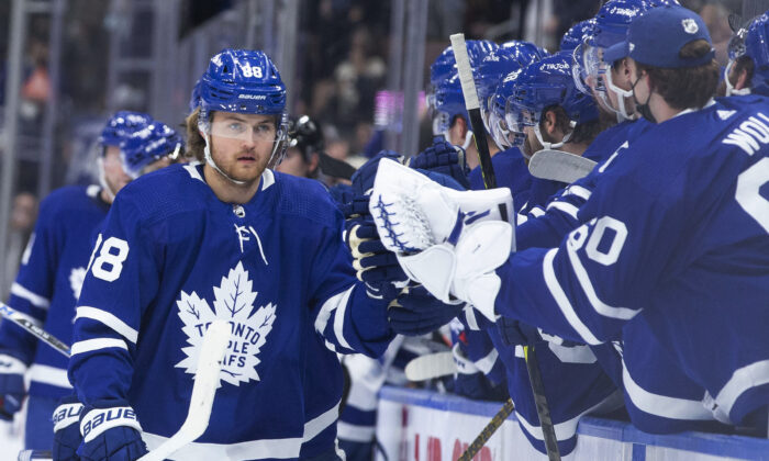 Toronto Maple Leafs' William Nylander is congratulated for his goal against the Tampa Bay Lightning, during an NHL game in Toronto, on Dec. 9, 2021. (Chris Young/The Canadian Press via AP)