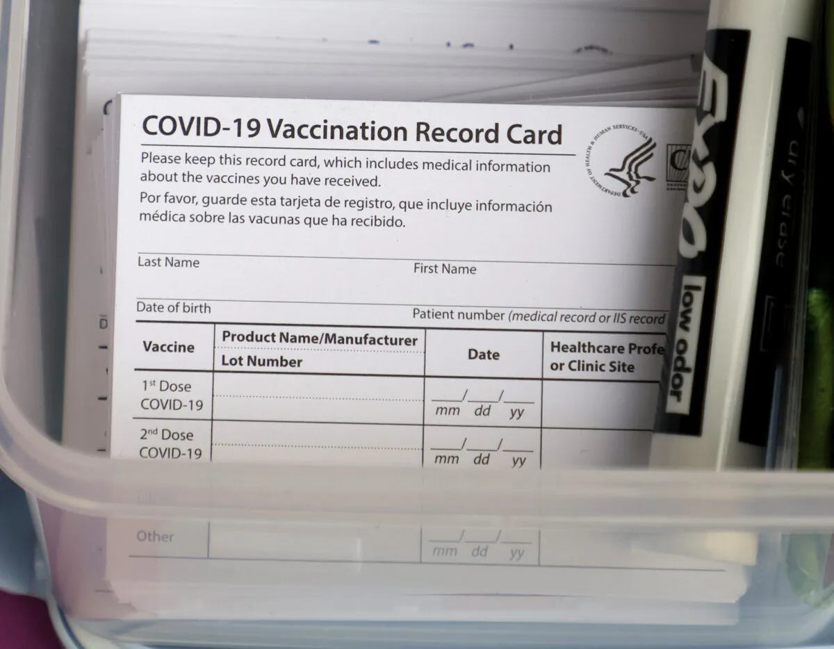 Blank COVID-19 vaccination cards are stacked at a pop-up COVID-19 vaccination clinic in Las Vegas, Nevada, on Dec. 21, 2021. (Ethan Miller/Getty Images)