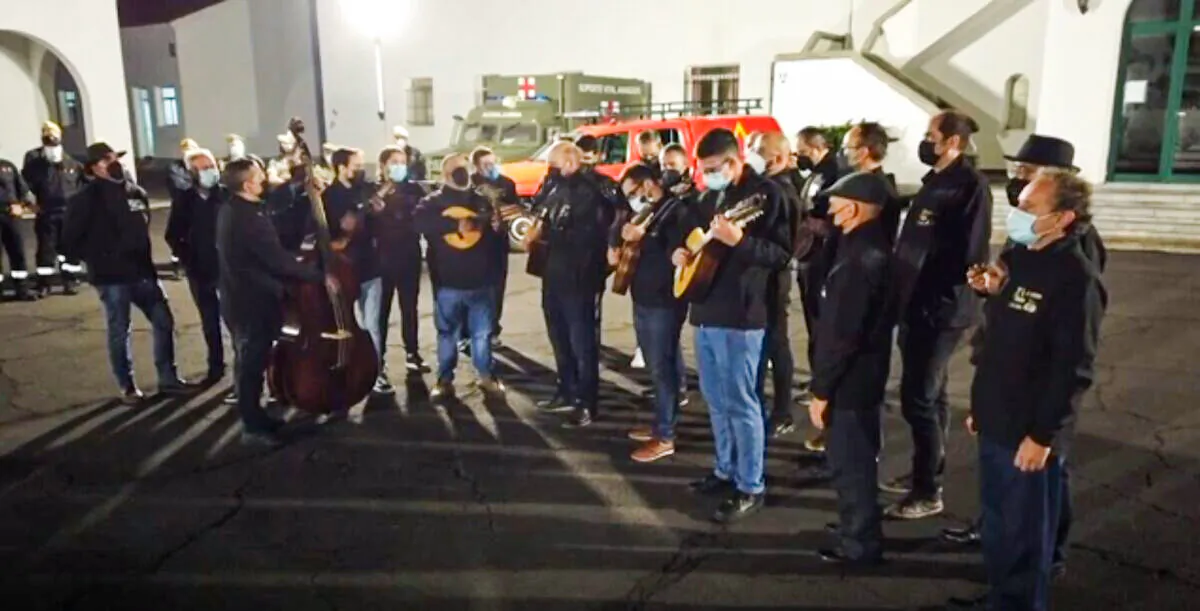 A video photo showing a sceen of group playing, during the carol tribute event for La Palma volcano workers, in the Canary Islands, Spain. (AP/Screenshot via The Epoch Times)