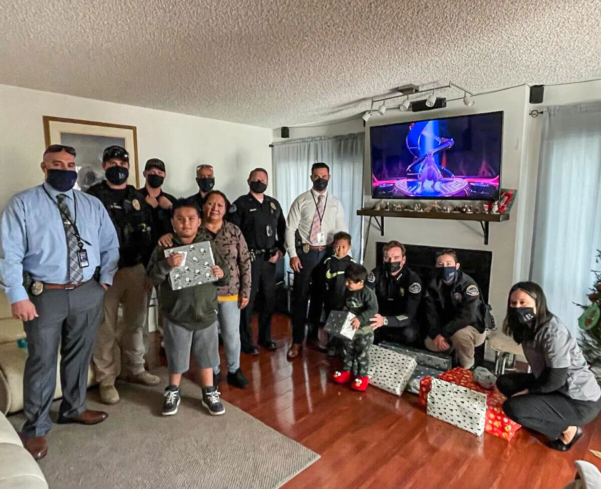The Huntington Beach Police Department made a local family’s Christmas a little more special this year by showing up on their doorstep with toys for their three boys in Huntington Beach, Calif., on Dec. 22, 2021. (Courtesy of Huntington Beach Police Department)