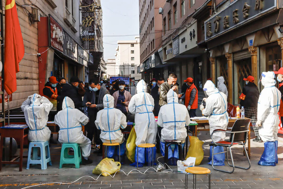 Medical staff members conduct nucleic acid tests for the COVID-19 coronavirus in Zhangye in China's northwestern Gansu Province, on Oct. 23, 2021. (STR/AFP via Getty Images)