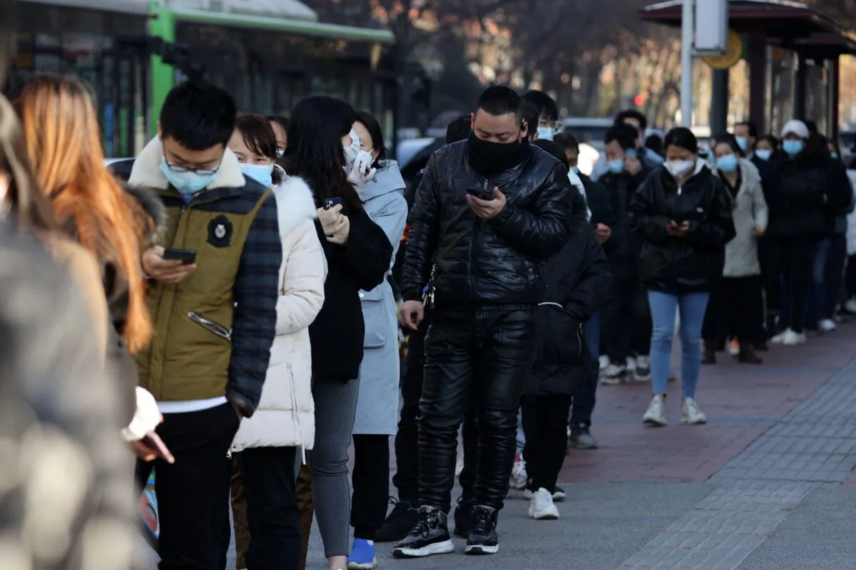 People line up to be tested for COVID-19 in Xi'an, in China's northern Shaanxi Province on Dec. 21, 2021. A surge of new cases raised concerns of wider transmission ahead of a busy travel season. (STR/AFP via Getty Images)