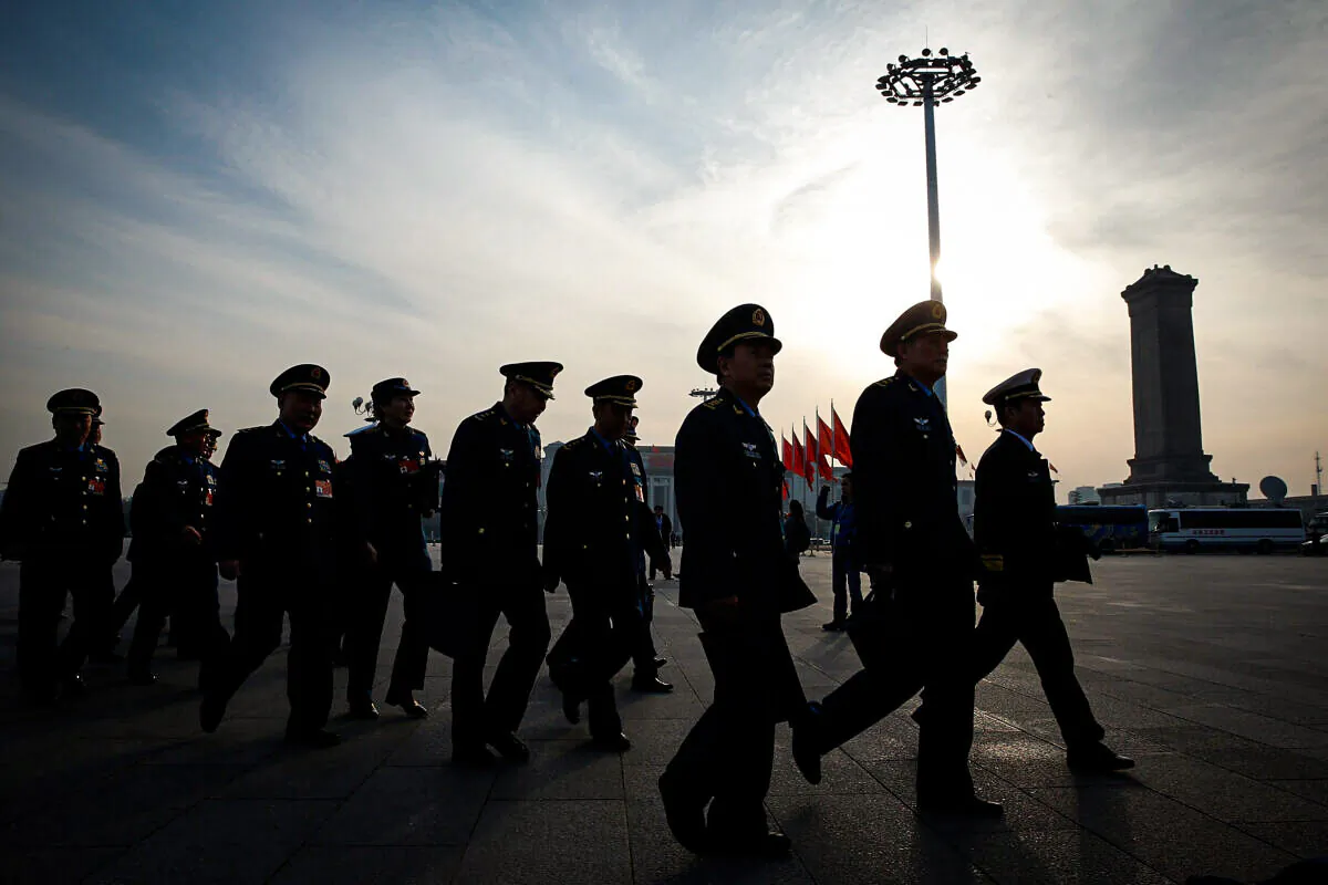 Chinese military delegates arrive at the Great Hall of the People before the third plenary session of China's rubber-stamp legislature, the National People's Congress, in Beijing on March 12, 2015. (Lintao Zhang/Getty Images)