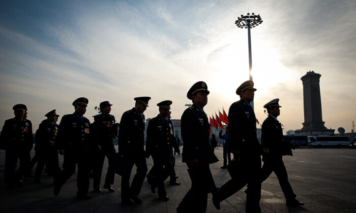 Chinese military delegates arrive at the Great Hall of the People before the third plenary session of China's rubber-stamp legislature, the National People's Congress, in Beijing on March 12, 2015. (Lintao Zhang/Getty Images)