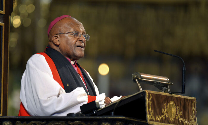 South African Archbishop Emeritus Desmond Tutu makes an address at Westminster Abbey in London during the memorial service for the former South African President Nelson Mandela, on March 3, 2014. (John Stillwell/Pool Photo via AP)