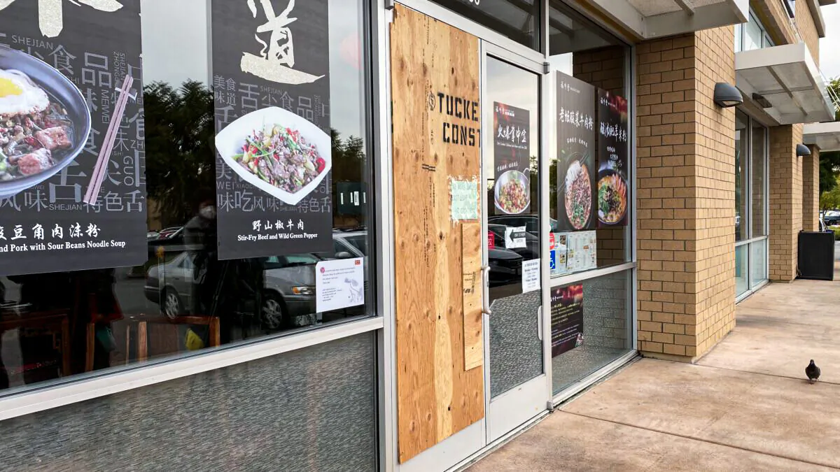 Boarded-up door at Noodle Talk in San Jose on Dec. 20, 2021. (Ilene Eng/The Epoch Times)