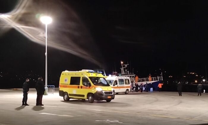 A video photo showing various of ambulances at the port of Paros, in Greece, after a boat with rescued migrants arrived. (AP/Screenshot via The Epoch Times)