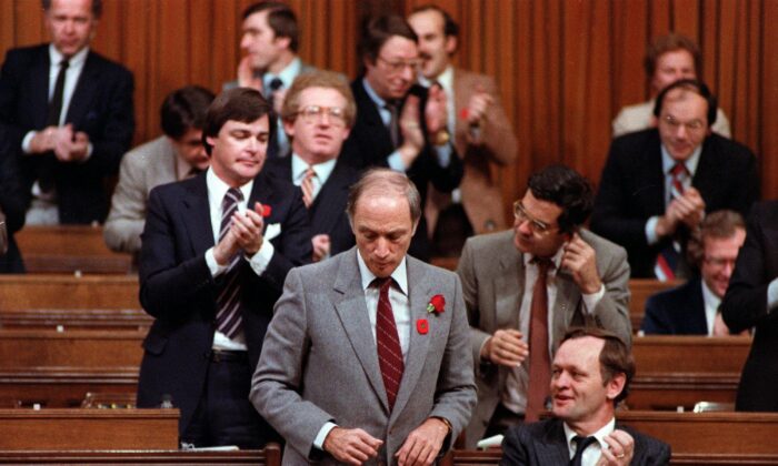 Prime Minister Pierre Trudeau gets a round of applause from Liberal MPs in the House of Commons after signing an accord with the provincial premiers during constitutional talks, in Ottawa on Nov. 5, 1981. (CP Photo/Fred Chartrand)