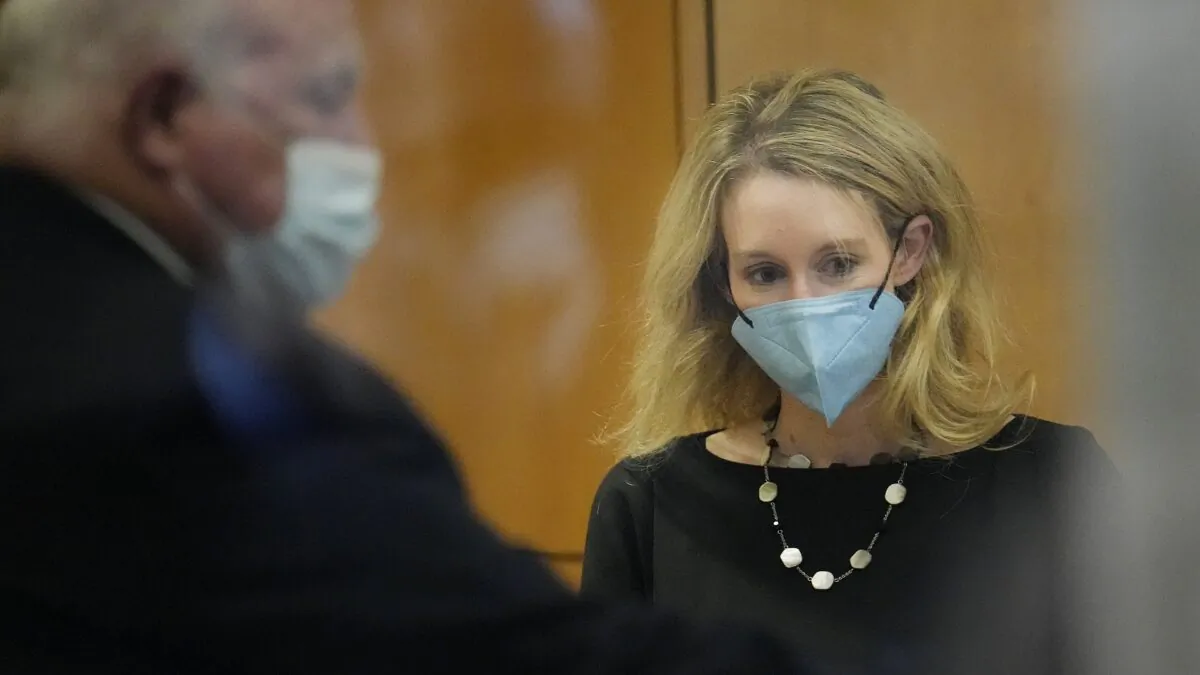 Former Theranos CEO Elizabeth Holmes walks into the Robert F. Peckham Federal Building and U.S. Courthouse for her trial in San Jose, Calif., on Dec. 21, 2021. (Tony Avelar/AP Photo)