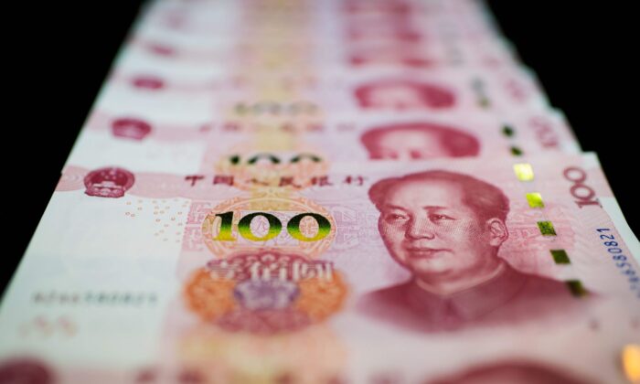 This photo illustration shows Chinese 100 yuan notes in Beijing on Jan. 14, 2020. (Nicolas Asfouri/AFP via Getty Images)