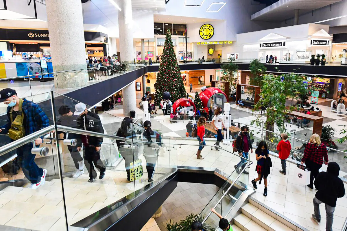 People walk at a shopping mall in Santa Anita, Calif., on Dec. 20, 2021. (Frederic J. Brown/AFP via Getty Images)