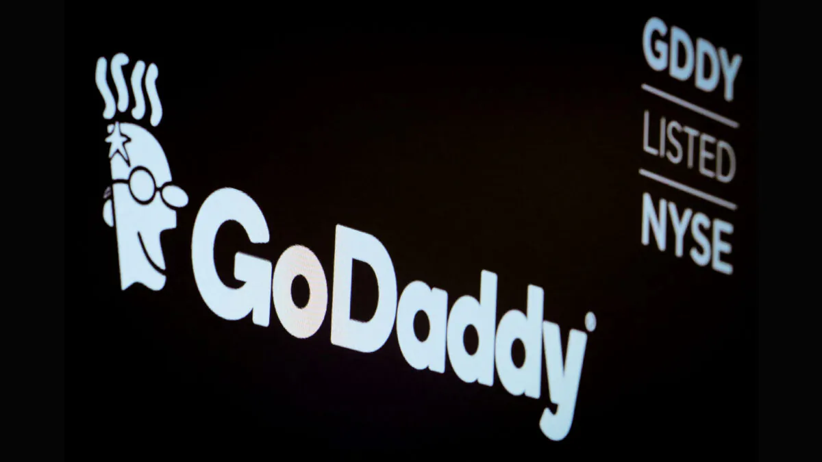 The company logo and ticker for GoDaddy Inc. is displayed on a screen on the floor of the New York Stock Exchange (NYSE) in New York, on March 4, 2019. (Brendan McDermid/Reuters)