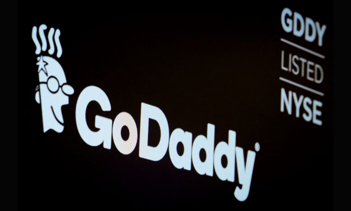 The company logo and ticker for GoDaddy Inc. is displayed on a screen on the floor of the New York Stock Exchange (NYSE) in New York, on March 4, 2019. (Brendan McDermid/Reuters)