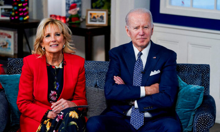 President Joe Biden and First Lady Jill Biden participate in NORAD Santa tracker phone calls from South Court Auditorium at the White House on Dec. 24, 2021. (Elizabeth Frantz/Reuters)
