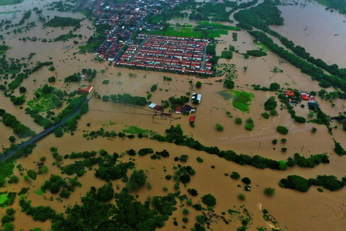 Aerial view of floods caused by heavy rains in the city of Itapetinga, southern region of the state of Bahia, Brazil, on Dec. 26, 2021. (Manuella Luana/AP Photo)