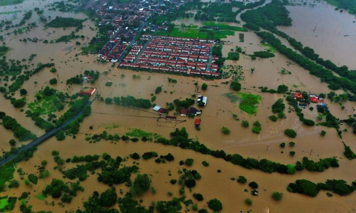 Aerial view of floods caused by heavy rains in the city of Itapetinga, southern region of the state of Bahia, Brazil, on Dec. 26, 2021. (Manuella Luana/AP Photo)