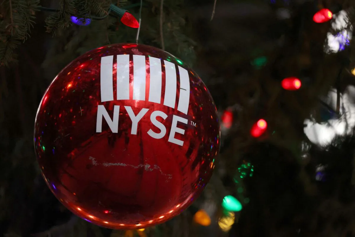 A decoration hangs on a Christmas tree outside the New York Stock Exchange (NYSE) on the last day of trading before Christmas in Manhattan, New York City, on Dec. 23, 2021. (Andrew Kelly/Reuters)