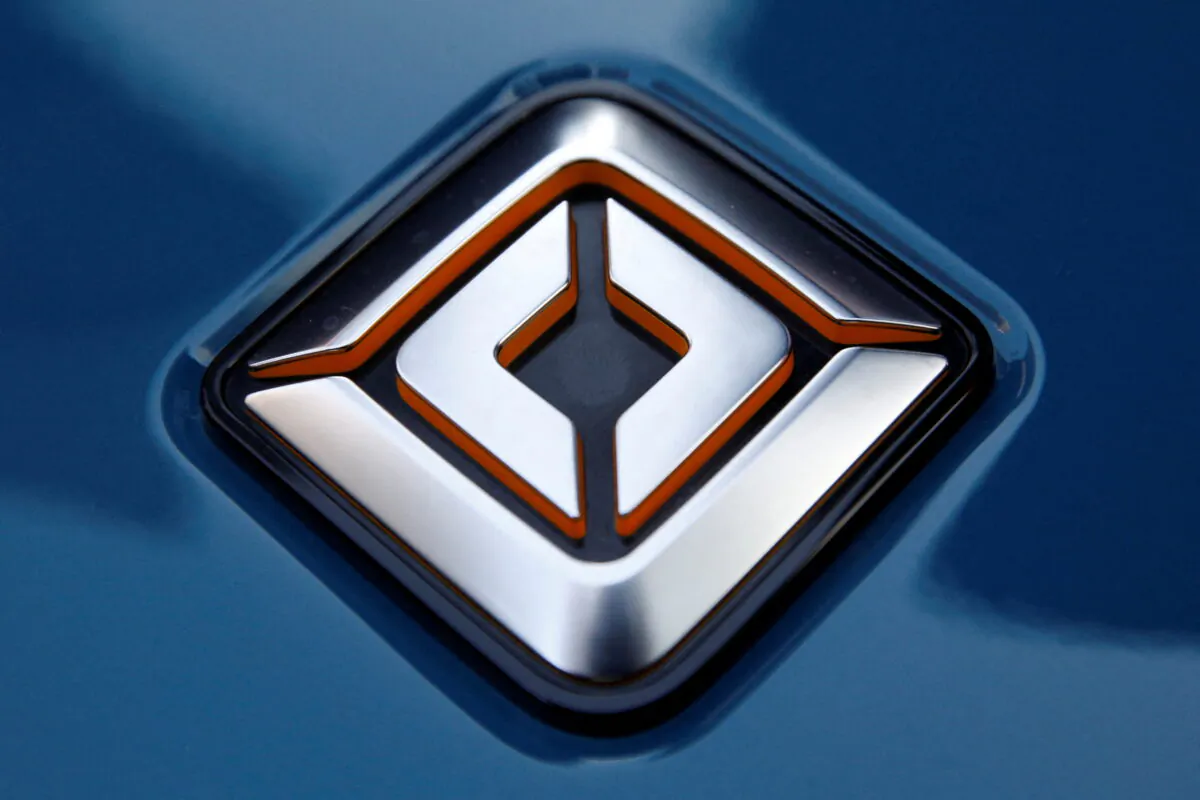 The company logo is seen on a Rivian R1T pickup, the Amazon-backed electric vehicle (EV) maker, as it is parked outside the Nasdaq Market site during the company’s IPO in Times Square in New York City, on Nov. 10, 2021. (Brendan McDermid/Reuters)