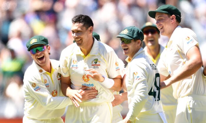 Scott Boland of Australia (2nd left) celebrates with teammates after dismissing Ollie Robinson of England during day 3 of the third Ashes Test between Australia and England at the MCG in Melbourne, Australia, on Dec. 28, 2021. (AAP Image/James Ross) 