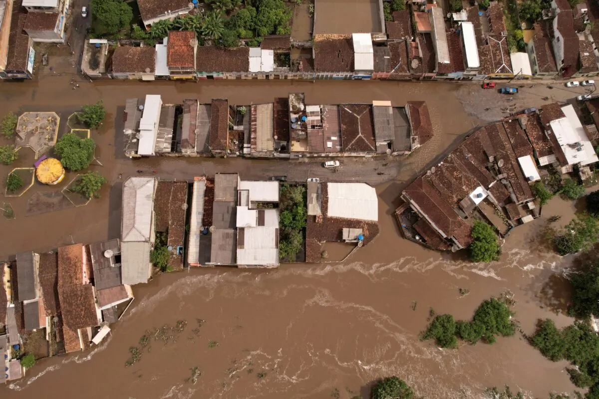 An aerial view shows flooded streets, caused due to heavy rains, in Itajuipe, Bahia state, Brazil, on Dec. 27, 2021. The picture was taken with a drone. (Amanda Perobelli/Reuters)