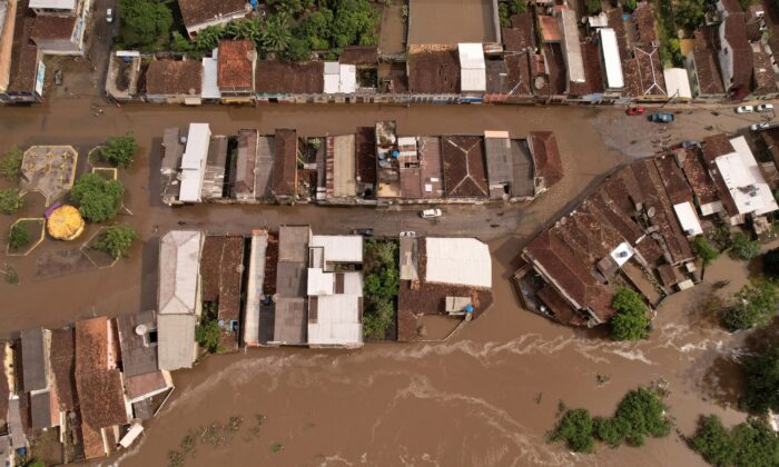 An aerial view shows flooded streets, caused due to heavy rains, in Itajuipe, Bahia state, Brazil, on Dec. 27, 2021. The picture was taken with a drone. (Amanda Perobelli/Reuters)